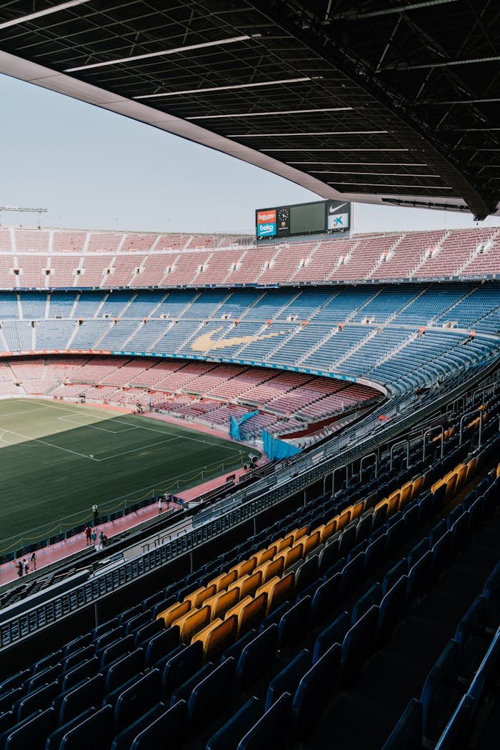 The Art of Drawing Readers In: Your attractive post title goes here A serene view of Camp Nou Stadium seating, showcasing its vastness and iconic design in Barcelona, Spain.